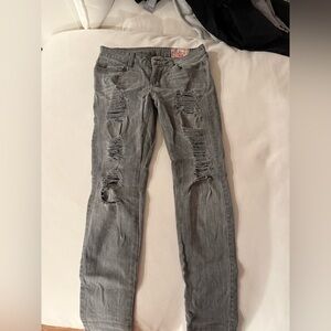 Grey distressed low-rise jeans with a ripped design #distresseddenim